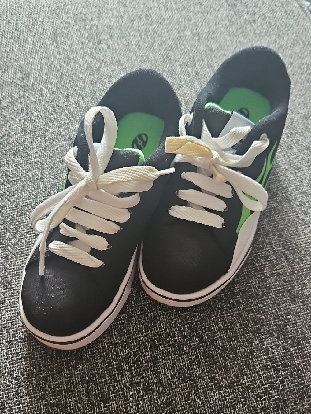 Heelys Black Sneakers with Green Accents and White Laces